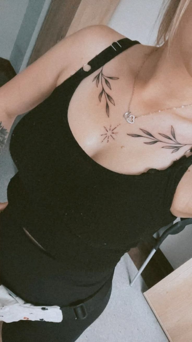 Elegant botanical branch tattoo across the collarbone showcasing clean, precise linework by a skilled tattoo artist in Lahore