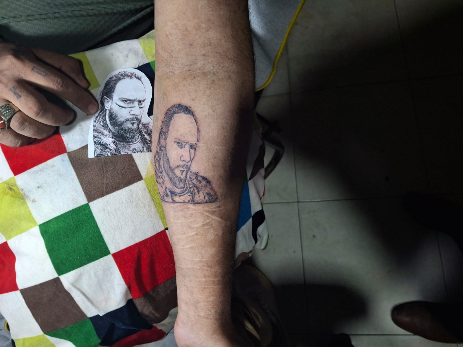 International tattoo artist in Lahore tattooing a custom realism design at Devil Tattoo Lahore