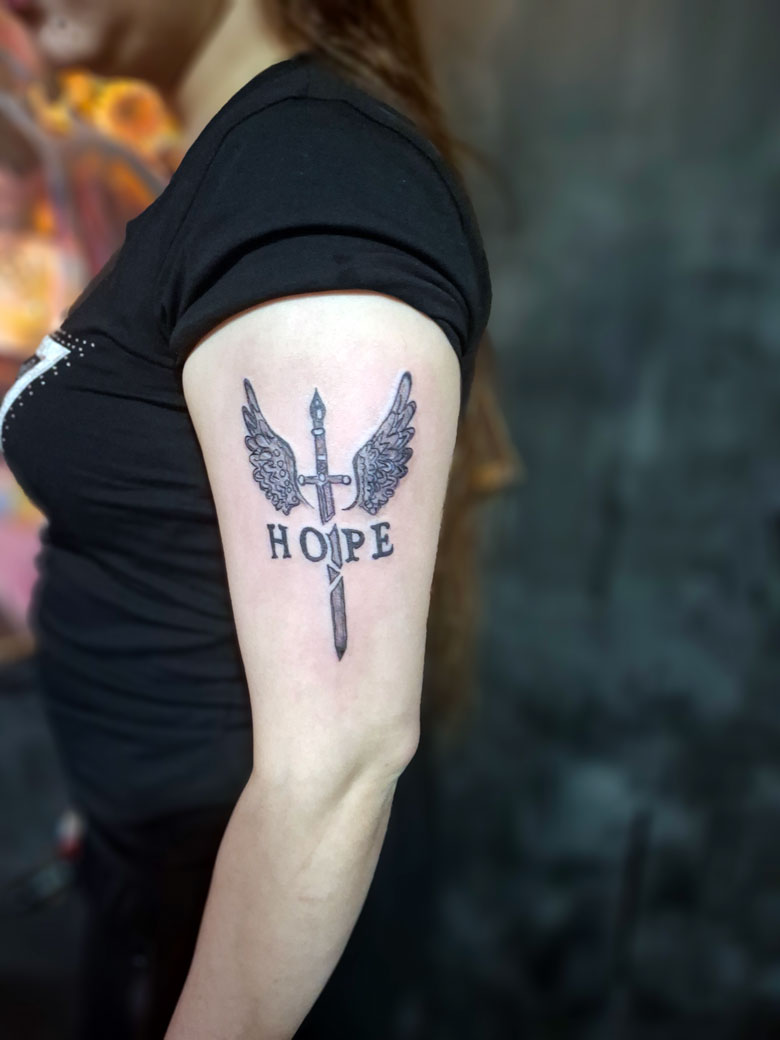 Hope wings and dagger tattoo design Devil Tattoo Lahore