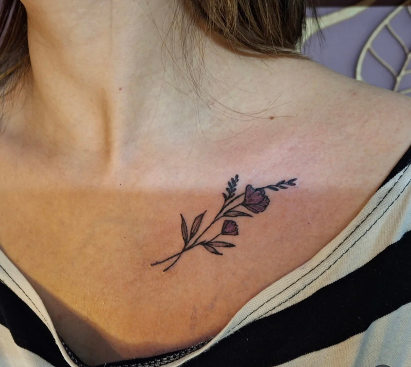 Floral tattoo on collarbone by Devil Art Studio Lahore