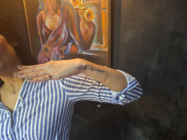 Custom script wrist tattoo created at a permanent tattoo shop in Lahore