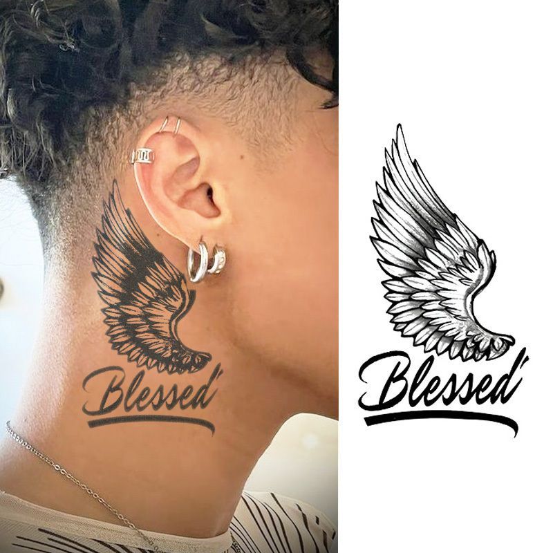 Close-up of a finely shaded wing tattoo behind the ear showcasing precise needle detail and shading technique