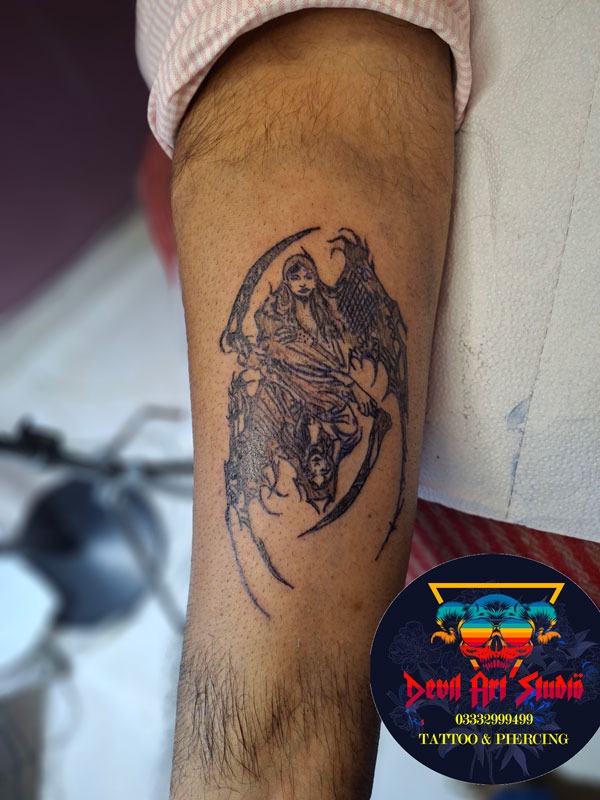 Detailed dark angel fine-line tattoo artwork available at seasonal discounted pricing at Devil Art Studio Lahore