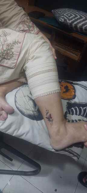 Small colourful butterfly and star ankle tattoo done at Devil Tattoo Lahore studio