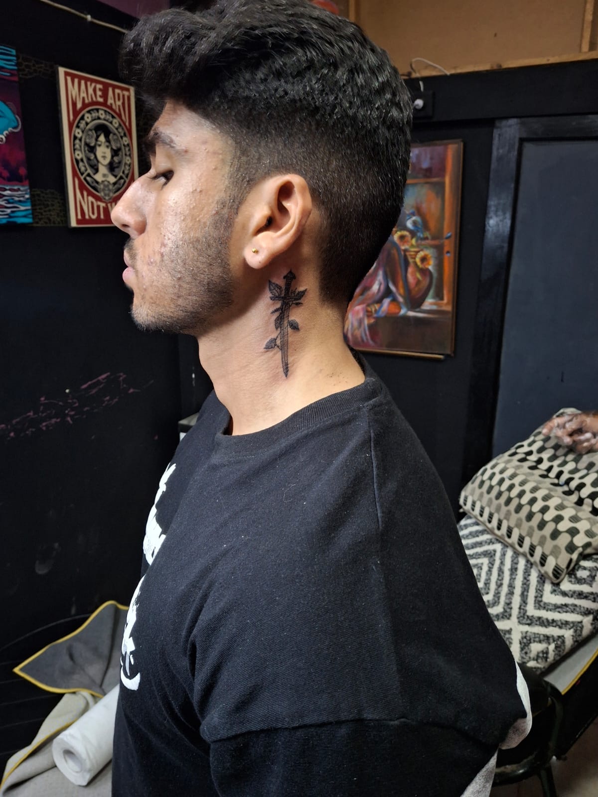 Small dagger and neck tattoo design for men, a hot tattoo idea trending in Lahore