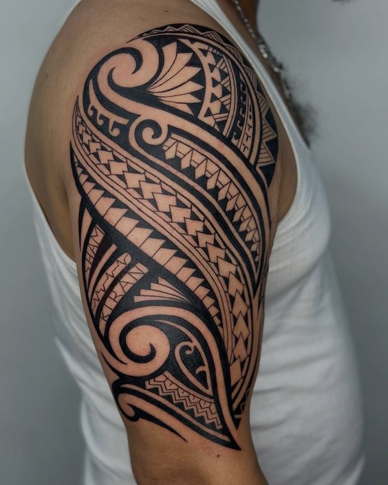 Detailed Polynesian tribal sleeve tattoo by Devil Art Studio Lahore