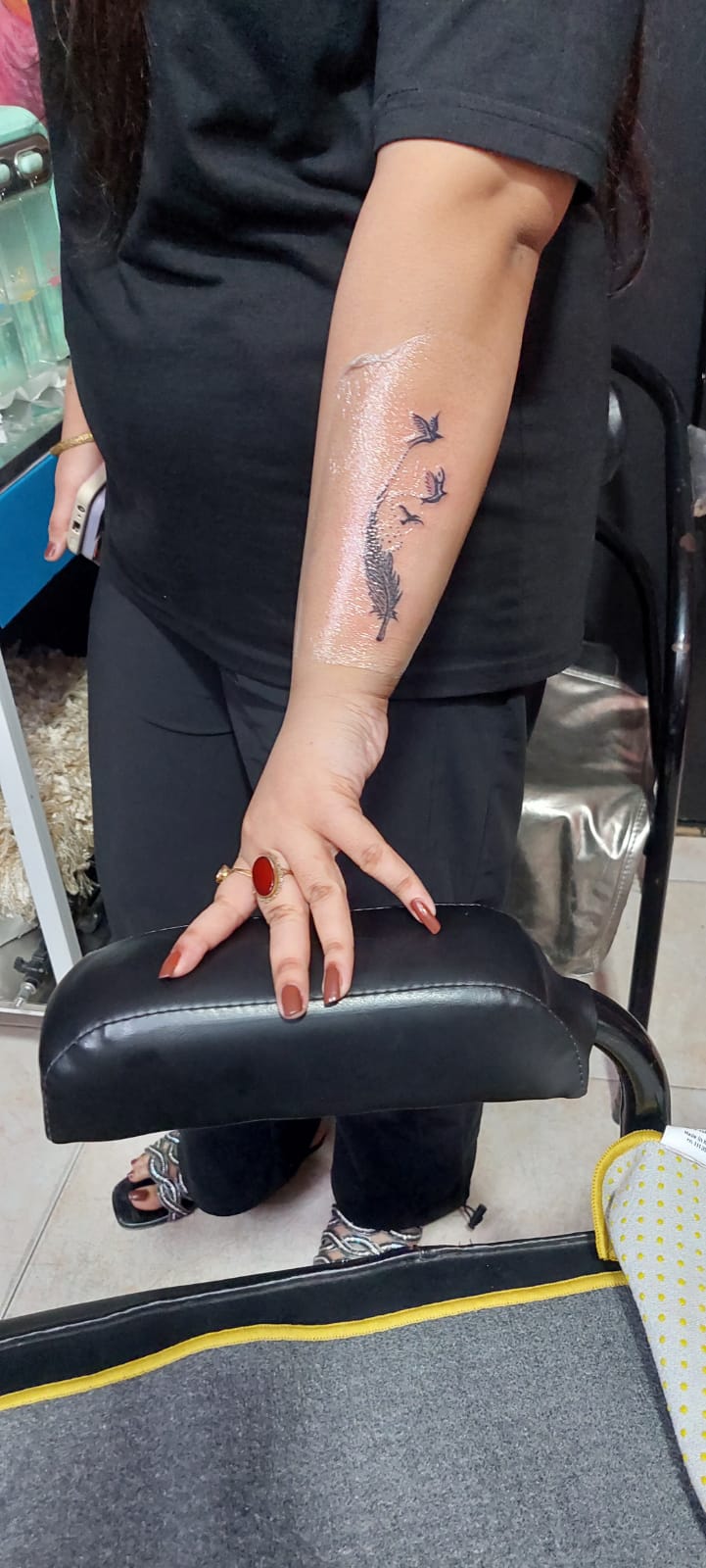 Feather turning into birds forearm tattoo by Devil Art Studio Lahore