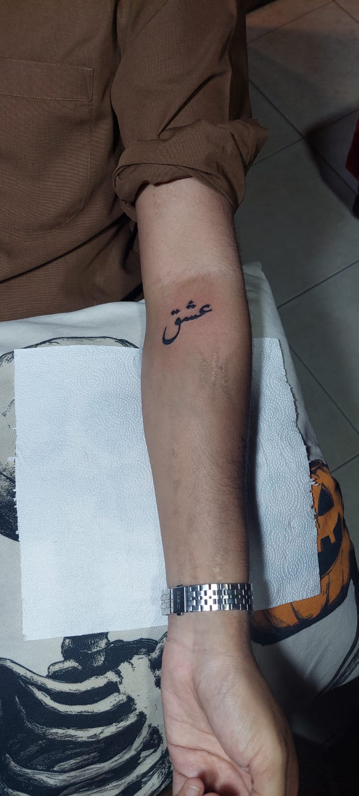 Urdu calligraphy Ishq tattoo on forearm by Devil Art Studio Lahore