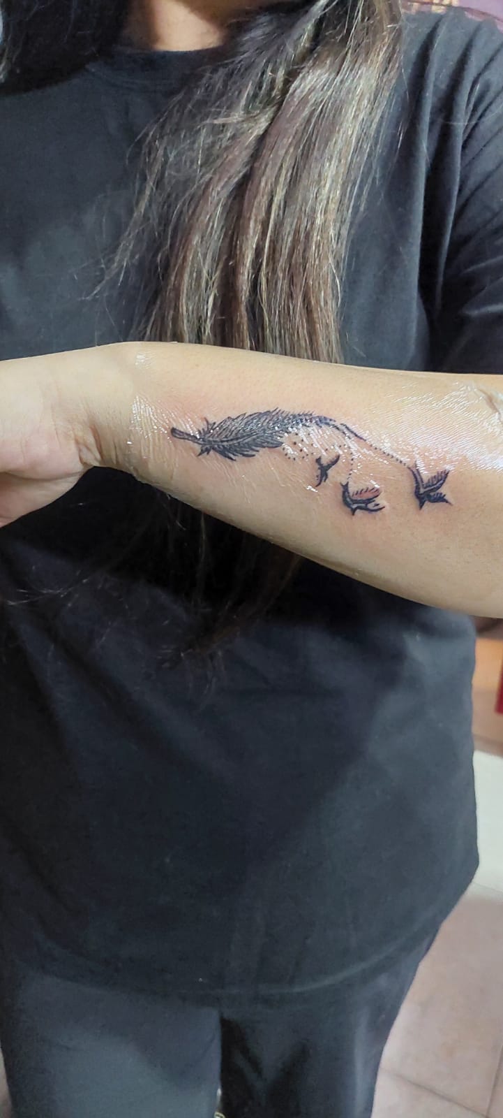 Feather and birds forearm tattoo fresh session by Devil Art Studio Lahore